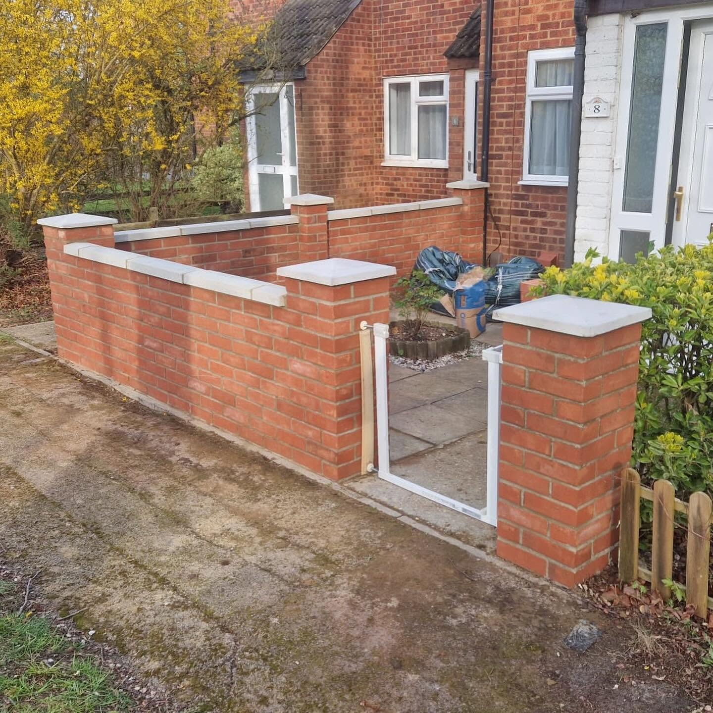 Completed red brick front garden wall with gate in Cambridge